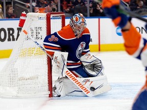 The Edmonton Oilers' goalie Jack Campbell (36) makes a save against the New York Islanders' Mathew Barzal (13) during second period NHL action at Rogers Place, in Edmonton Thursday Jan. 5, 2023. Photo By David Bloom