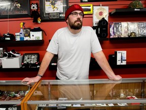 Big C Pawn co-owner Mitchel Zohner poses at his store in Edmonton on Monday Jan. 9, 2023. Zohner and an employee were both shot during a Dec. 16, 2022, robbery.