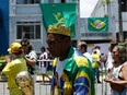 Soccer Football - Death of Brazilian soccer legend Pele - Vila Belmiro Stadium, Santos, Brazil - January 2, 2023
General view of a fan with a replica of the World cup queues to pay their respect to Brazilian soccer legend Pele REUTERS/Amanda Perobelli