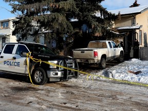Police work at the scene of a suspicious death at 17203 102 St. in Edmonton on Saturday, Jan. 14, 2023. On Jan. 12, 2023, at about 6:45 p.m., police were called to a home for an assault involving a 41-year-old injured man.