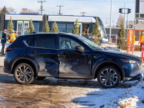 A vehicle that collided with the LRT at the corner of 82 Avenue and 83 Street remains in a parking lot close by on Saturday, Jan. 21, 2023 in Edmonton.