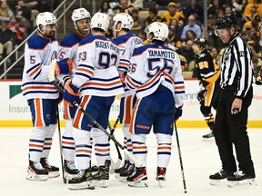 Ryan Nugent-Hopkins #93 of the Edmonton Oilers celebrates with teammates after scoring a goal in the second period during the game against the Pittsburgh Penguins at PPG PAINTS Arena on February 23, 2023 in Pittsburgh, Pennsylvania.