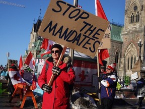 Truck drivers and their supporters block streets during an anti-vaccine mandate protest near the Parliament buildings in Ottawa on Feb. 15.