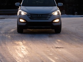 A Hyundai SUV is driven along a slippery, icy road at Ada Boulevard and 75 in Edmonton, on Tuesday, Nov. 5, 2019.