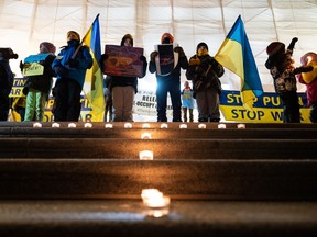 Local Ukrainians demonstrate their support for family and friends in Ukraine and here at home during the invasion of the European country by Russia during a rally at the Alberta legislature in Edmonton on Feb. 24, 2022.