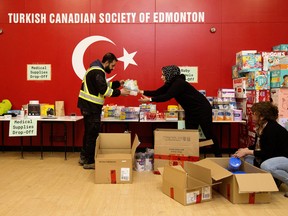 Members of the Turkish Canadian Society of Edmonton gather supplies at the organization's cultural centre (15450 105 Ave.) to send to Turkey following earthquakes on Monday.