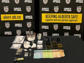 ALERT Fort McMurray have charged two men with drug offences after officers seized cocaine and cash from an apartment in the northern city.