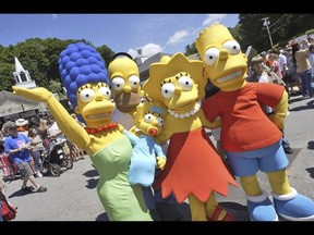 Characters from The Simpsons pose before the premiere of "The Simpsons Movie", Springfield, Vermont, July 21, 2007. Walt Disney Co. has been recently removed an episode from cartoon series The Simpsons that included a reference to "forced labor camps" in China from its streaming service in Hong Kong. (AP Photo)