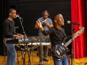 The Melisizwe Brothers, Seth on keyboard, left, and Zacary on bass, play at Jasper Place High School on Friday, Feb. 3, 2023. They will be touring schools throughout the Edmonton public school division to share their musical talents as part of Black History Month.