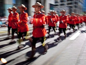 Members of the Royal Canadian Mounted Police march during the Calgary Stampede parade in this file photo.
