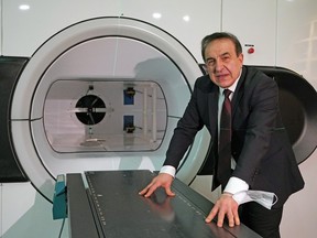 Dr. Gino Fallone, medical physicist and creator of the Linac-MR (LMR) machine, with the LMR machine at the Cross Cancer Institute in Edmonton on February 3, 2023. The LMR will provide ultimate precision in the treatment of tumours, leading to improved patient outcomes, reduced number of treatments required and reduced radiation exposure to healthy organs.