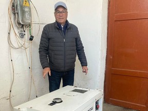 Dennis Scraba of Amigo Relief Missions with a generator his charity supplied to the Dombromil State Orphanage in Dombromil, Ukraine earlier this month.