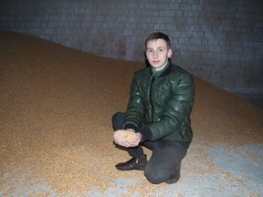 Farmer and Ukrainian military volunteer Oleh His inspects his grain crop in the small town of Cherneve in western Ukraine on Sunday, Feb. 19, 2023. He's received several grain storage sleeves from Canada through the UN Food and Agriculture Organization after the Russian invasion destabilized the country's food supply.