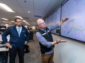 Public Safety and Emergency Services Minister Mike Ellis, left, and Stephen Lacroix, managing director, Alberta Emergency Management Agency tour the upgraded Provincial Emergency Coordination Centre during Alberta's emergency management exercise 2023 on Wednesday, Feb. 1, 2023.