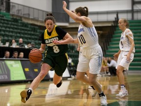 University of Alberta Pandas guard Emma Kary (8) battles the University of Lethbridge Pronghorns' Amy Mazutinec (10) during Canada West playoff quarter-finals at the Saville Centre in this file photo from Feb. 15, 2019.