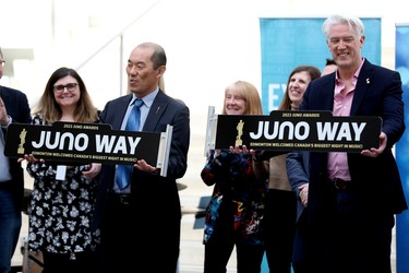 (left to right) Alberta Minister of Culture Jason Luan and Juno Awards CEO Alan Reid display Juno Way road signs during a 2023 Junos kickoff celebration at Edmonton City Hall, Thursday March 9, 2023. 104 Avenue from 101 Street to 104 street has been renamed Juno Way.