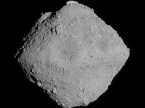 The carbonaceous asteroid Ryugu is seen from a distance of about 12 miles (20 km) during the Japanese Space Agency's Hayabusa2 mission on June 30, 2018.
