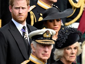 Prince Harry, Duke of Sussex, and Meghan, Duchess of Sussex, Queen Camilla and King Charles attend the state funeral and burial of Queen Elizabeth, in London, September 19, 2022. REUTERS/Toby Melville//File Photo