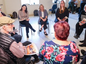 NDP Lethbridge West candidate Shannon Phillips, left, NDP Leader Rachel Notley, left, and  Edmonton-Mill Woods NDP candidate Christina Gray meet with seniors at the Triwood Community Association in Calgary on March 23, 2023.