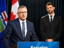 Alberta Finance Minister Travis Toews speaks about a bill that if passed would implement many of the technical measures from Budget 2023 on Thursday, March 9, 2023 in Edmonton, with UCP MLA Dan Williams, right.