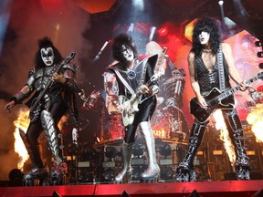 From left, vass guitarist Tommy Thayer, Gene Simmons and Paul Stanley of US rock band Kiss perform in Bogota on May 7, 2022.