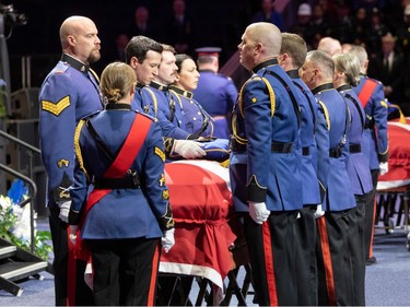 Officers and loved ones take part Monday, March 27, in the regimental funeral for constables Travis Jordan and Brett Ryan, who were fatally shot while responding to a call on March 16, 2023.