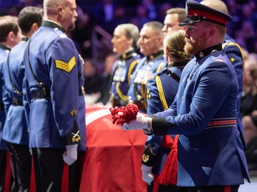 Officers and loved ones take part Monday, March 27, in the regimental funeral for constables Travis Jordan and Brett Ryan, who were fatally shot while responding to a call on March 16, 2023.