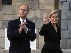 Britain's Prince Edward and Sophie, Countess of Wessex, wave to mourners outside the Windsor Castle in Windsor, England, on Sept. 16, 2022.