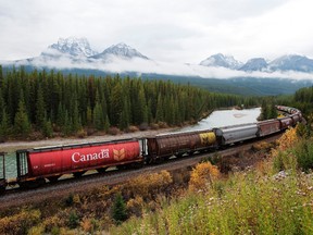 FILE PHOTO: Rail cars loaded with canadian wheat travel through the Rocky Mountains on the Canadian Pacific railway line near Banff, Alberta, October 6, 2011. REUTERS/Todd Korol/File Photo