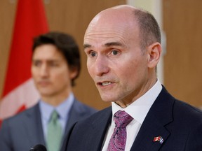 FILE PHOTO: Canada's Minister of Health Jean-Yves Duclos, with Prime Minister Justin Trudeau, takes part in a news conference after touring a medical training facility in Ottawa, Ontario, Canada, February 7, 2023.
