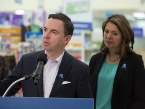 Health Minister Jason Copping, left, and Premier Danielle Smith provide an update on the government’s efforts to import children’s pain and fever medications on March 20, 2023.