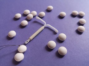 A hormonal IUD surrounded by birth control pills. Prescription contraceptives become free in B.C. starting April 1.: