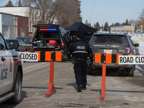 Police continue to work at a scene near 14544 72 St. following a suspicious death in Edmonton, Wednesday March 15, 2023. At about 6:25 a.m., police responded to a weapons complaint north of 144 Avenue and 72 Street. When officers arrived, they found a male lying dead in the street.