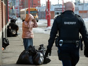 Alberta Sheriff Sgt. Anthony Burgess patrols outside the Hope Mission in Edmonton on March 2, 2023.