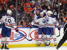 Mar 6, 2023; Buffalo, New York, USA; Edmonton Oilers center Connor McDavid (97) celebrates his goal with teammates during the first period against the Buffalo Sabres at KeyBank Center. Mandatory Credit: Timothy T. Ludwig-USA TODAY Sports