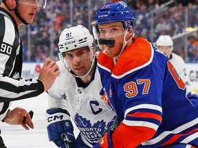 Mar 1, 2023; Edmonton, Alberta, CAN; Edmonton Oilers forward Connor McDavid (97) and Toronto Maple Leafs forward John Tavares (91) follow a loose puck during the second period at Rogers Place. Mandatory Credit: Perry Nelson-USA TODAY Sports