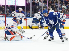 Mar 11, 2023; Toronto, Ontario, CAN; Toronto Maple Leafs right wing William Nylander (88) battles for the puck in front of Edmonton Oilers goaltender Stuart Skinner (74) during the first period at Scotiabank Arena. Mandatory Credit: Nick Turchiaro-USA TODAY Sports