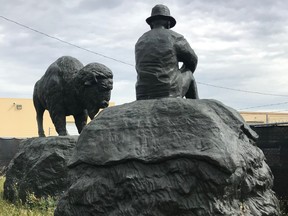 Public art by Ken Lum, called The Buffalo and The Buffalo Fur Trader, sit in an Edmonton storage yard in this supplied image. The art was designed for the new Walterdale Bridge that opened in 2018, but the city has since decided not to install it over concerns about its appropriateness at a time when it is trying to advance Indigenous reconciliation.