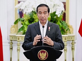 In this photo released by the Press and Media Bureau of the Indonesian Presidential Palace, Indonesian President Joko Widodo delivers his statement at Merdeka Palace in Jakarta, Indonesia, Tuesday, March 28, 2023. Widodo said Tuesday that his administration is trying to save the FIFA Under-20 World Cup following the cancelation of the official draw for group assignments in the youth soccer tournament, after regional governors and protesters demanded Israel's team be excluded. (Indonesian Presidential Palace via AP)