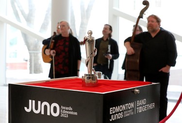 The Host City Juno is visible in the foreground as The McDades wait to perform during a 2023 Junos kickoff celebration at Edmonton City Hall, Thursday March 9, 2023.
