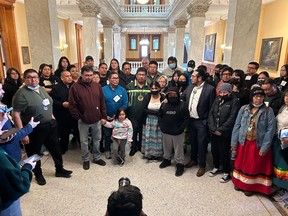 Neskantaga Chief Wayne Moonias, centre in green, speaks alongside First Nations community members during an improvised press conference inside the Ontario Legislature, at Queen's Park, in Toronto, Wednesday, March 29, 2023. Moonias was one of two First Nation leaders who were kicked out of Ontario's legislature for shouting at Premier Doug Ford to meet with them over mining concerns on their lands in the "Ring of Fire" region.