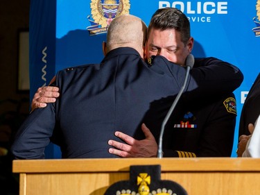 Police Chief Dale McFee hugs Joe Zatylny , Fire Chief,  after a press conference dealing with two officers that were killed Thursday morning while responding to a call in the city's northwest. The officers were identified as Const. Travis Jordan, 35 and Const. Brett Ryan, 30. Jordan was an 8.5-year veteran of the Edmonton Police Service, while Ryan was with the EPS for 5.5 years. Taken on Thursday, March 16, 2023 in Edmonton.