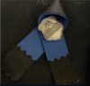 The thin blue line memorial band and ribbon over the heart of a police officer on Thursday, March 16, 2023, at the Edmonton Police Service downtown headquarters.