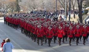 Police officers march from the Alberta Legislature to Rogers Place for the regimental funeral for two EPS officers, constables Brett Ryan and Travis Jordan, killed in the line of duty on March 16, 2023. Taken on Monday, March 27, 2023 in Edmonton.