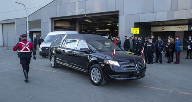 The hearse carrying the body of constables Brett Ryan leaves Rogers Place following the regimental funeral for constables Ryan and Travis Jordan, killed in the line of duty on March 16, 2023. Taken on Monday, March 27, 2023 in Edmonton.