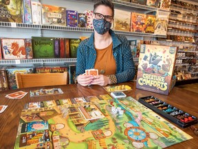 Local game designer Roberta Taylor with her latest game, Creature Comforts, which will be features at this weekend's GOBfest.