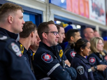 First responders watch  the Battle for the Badges Charity Hockey Game which will raise funds for The Legacy Place Society and the GoFundMe Memorial Fundraiser for Const. Brett Ryan and Const. Travis Jordan. Const. Brett Ryan's family resides in the community of Spruce Grove and Brett was an Official Referee with the Spruce Grove Minor Hockey Association. Brett was an Official in the Battle for the Badges game in 2022 and had planned to be again in the 2023 game. Taken on Wednesday, March 22, 2023 in Spruce Grove. Const. Brett Ryan and Const. Travis Jordan were killed while responding to a domestic violence call.