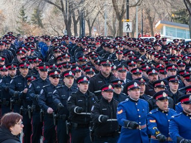 Police officers march from the Alberta Legislature to Rogers Place for the regimental funeral for two EPS officers, constables Brett Ryan and Travis Jordan, killed in the line of duty on March 16, 2023. Taken on Monday, March 27, 2023 in Edmonton.