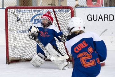 Goaltender Jesse Saik, 11, watches a shot as he takes part in the Kids World's Longest Hockey Game in support of the Ben Stelter Fund and the Stollery Children's Hospital, at Saiker's Acres, 52269 Range Rd 220, east of Edmonton Saturday March 4, 2023.