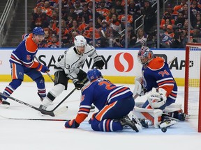 Stuart Skinner #74 of the Edmonton Oilers makes a save off a shot by Viktor Arvidsson #33 of the Los Angeles Kings in the third period in Game 1 of the first round of the 2023 Stanley Cup Playoffs on Monday, April 17, 2023, at Rogers Place in Edmonton.